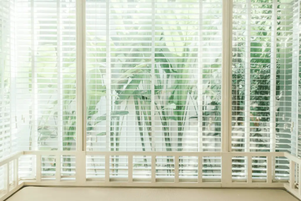 a window with blinds in a room