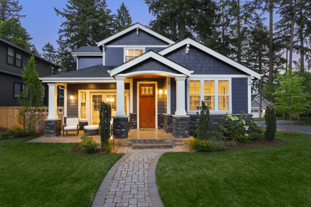 a house with a brick walkway and a lawn