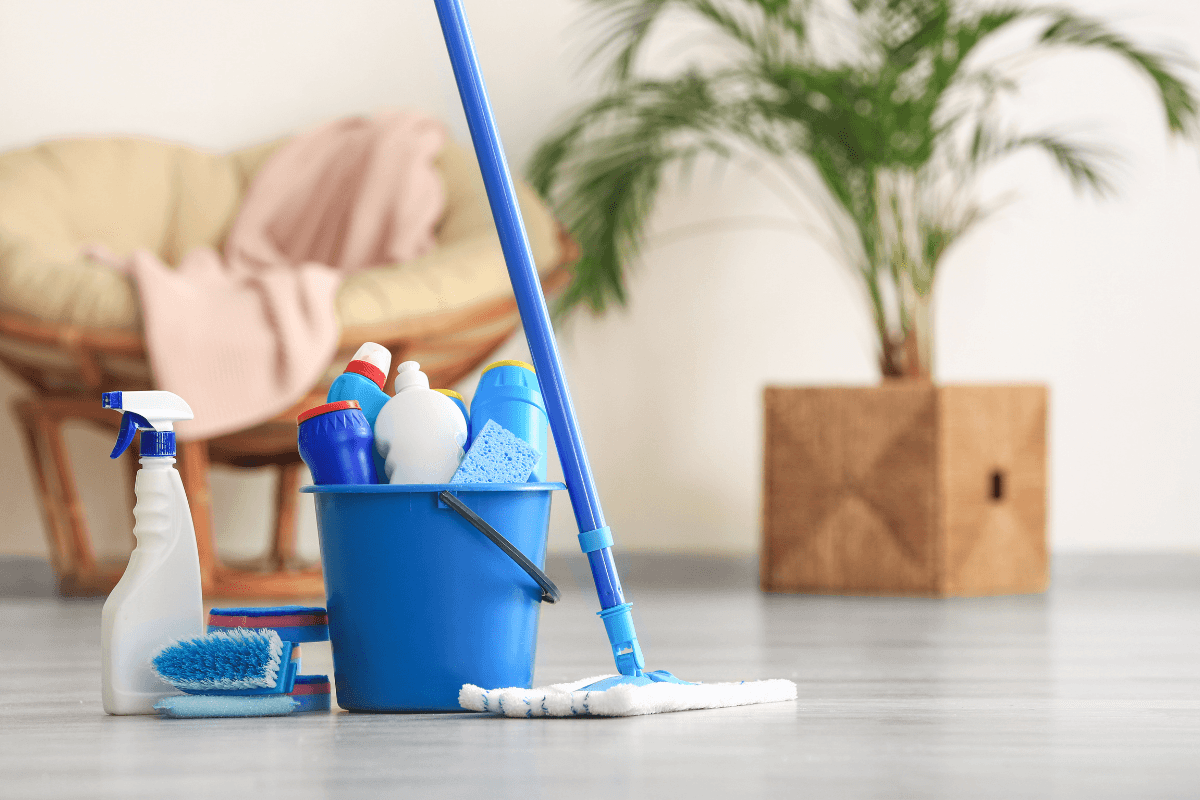 a bucket of cleaning supplies on the floor
