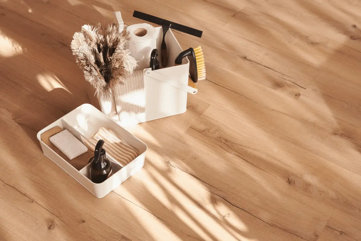 a cleaning supplies on a wood floor
